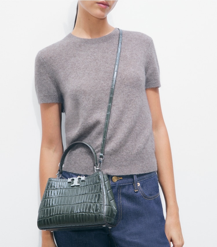 Tory Burch designer crossbody bags Mini Eleanor Croc-Embossed Satchel in Artichoke accessory on model