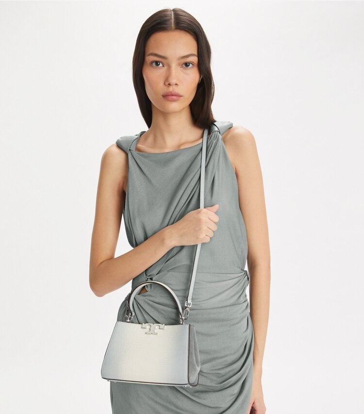 Tory Burch designer crossbody bags Mini Eleanor Henkeltasche mit Reptilien-Prägung in Blanc accessory on model