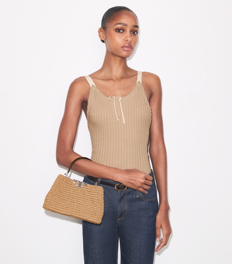 Tory Burch designer crossbody bags Mini Eleanor Raffia Satchel in Honeycomb accessory on model