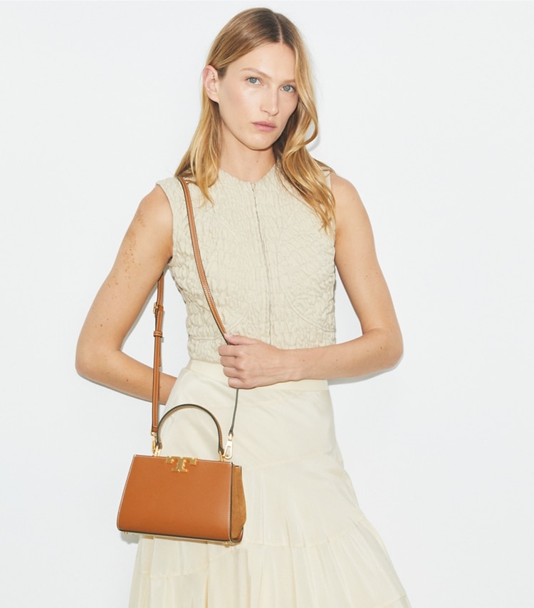Tory Burch designer crossbody bags Mini Eleanor Satchel in Malt Whiskey accessory on model