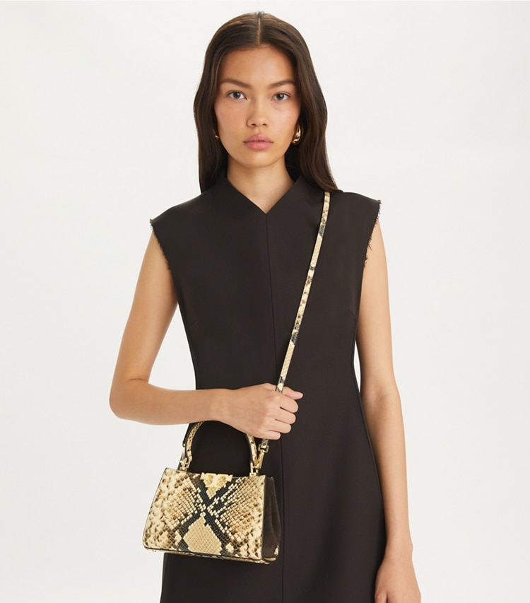 Tory Burch designer crossbody bags Mini Eleanor Satchel in Coriander / Black Multi accessory on model