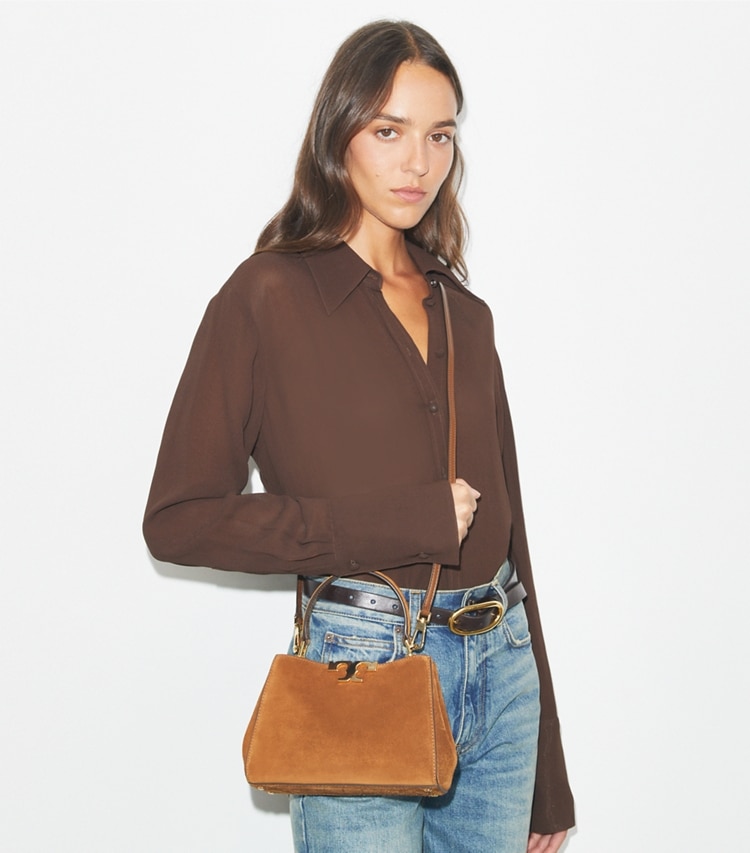 Tory Burch designer crossbody bags Mini Eleanor Suede Satchel in Park Bench accessory on model