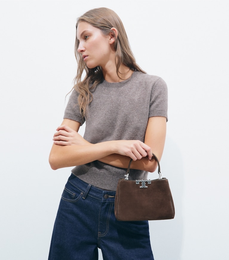 Tory Burch designer クロスボディバッグ エレノア スエード ミニ サッチェルバッグ in Dark Cocoa accessory on model