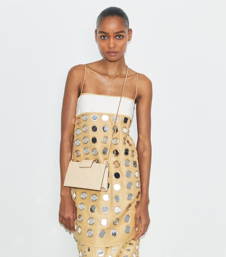 Tory Burch designer mini bags Mini Fleming Crossbody in Vanilla Soft Serve accessory on model