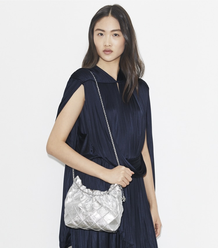 Tory Burch designer crossbody bags Mini Fleming Metallic Hobo Bag in Silver accessory on model