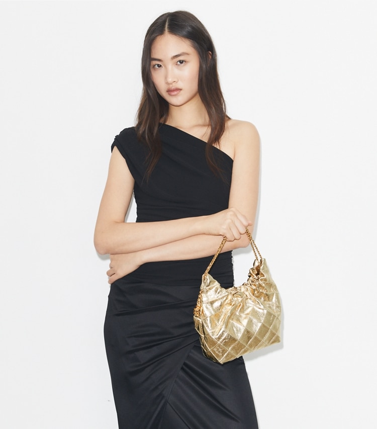 Tory Burch designer crossbody bags Mini Fleming Metallic Hobo Bag in GOLD additional on model