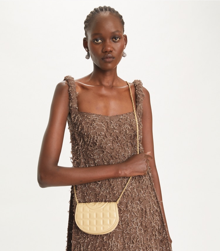 Tory Burch designer mini bags Mini Fleming Patent Square Quilt Crossbody in Vanilla Soft Serve accessory on model