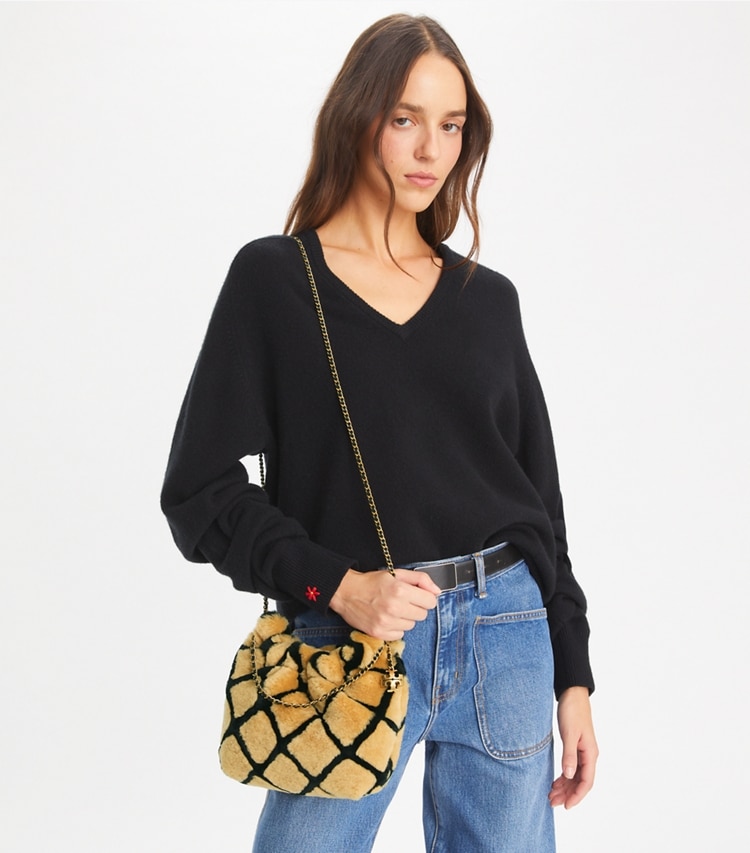 Tory Burch designer crossbody bags Mini Fleming Shearling Hobo Bag in Toffee accessory on model
