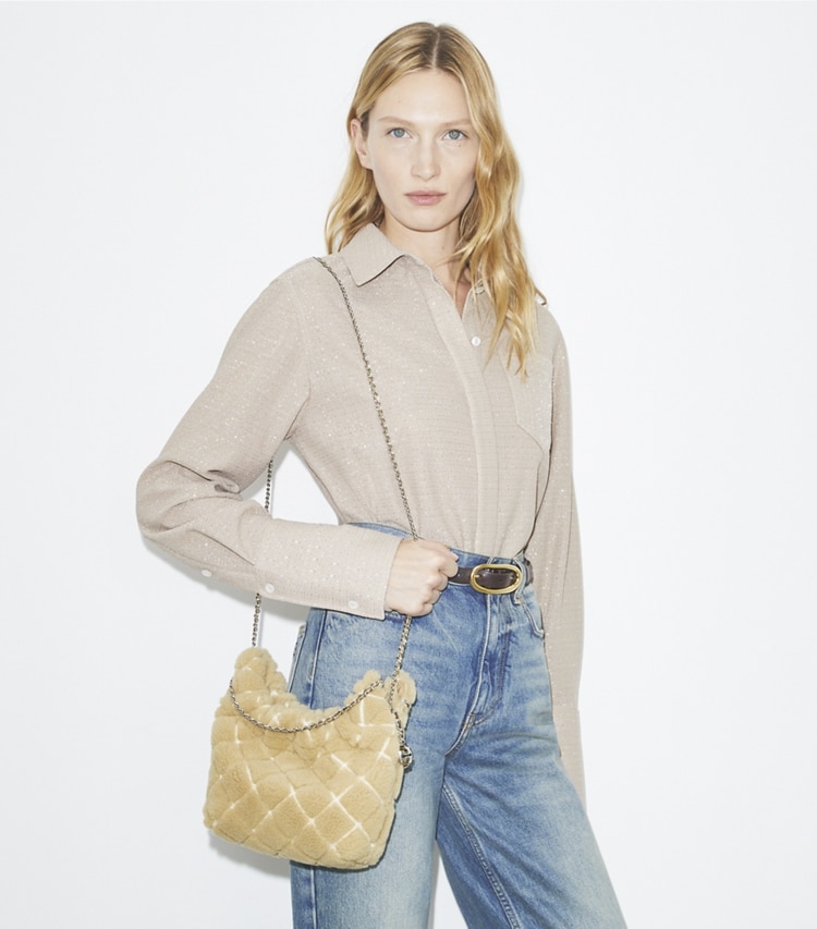 Tory Burch designer crossbody bags Mini Fleming Shearling Hobo Bag in Ivory accessory on model