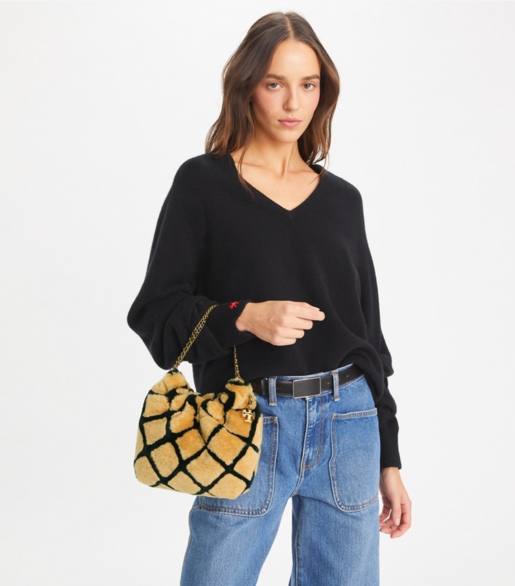 Tory Burch designer crossbody bags Mini Fleming Shearling Hobo Bag in Toffee additional on model