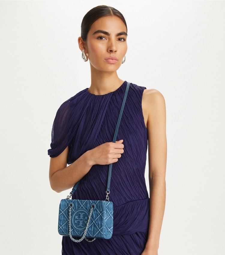 Tory Burch designer crossbody bags Mini Fleming Soft Denim Chain Tote in Denim accessory on model
