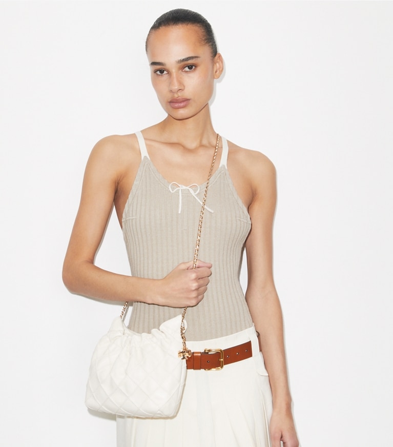 Tory Burch designer crossbody bags Mini Fleming Soft Hobo Bag in Light Cream accessory on model