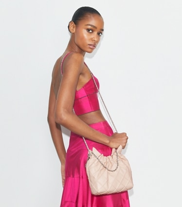 Tory Burch designer crossbody bags Mini Fleming Soft Hobo Bag in Soft Pink accessory on model