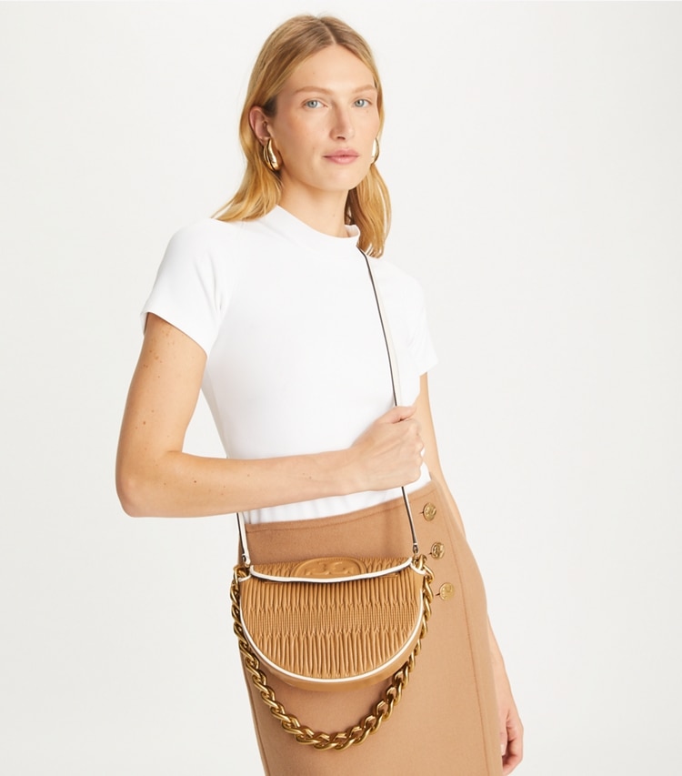 Tory Burch designer shoulder bags Mini Fleming Soft Pleated Crescent Bag in DUSTY ALMOND additional on model