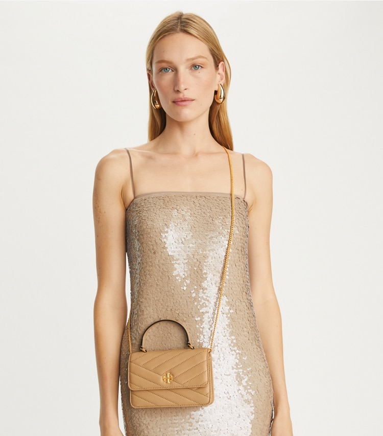 Tory Burch designer mini bags Mini Kira Chevron Top Handle Crossbody in Desert Dune accessory on model