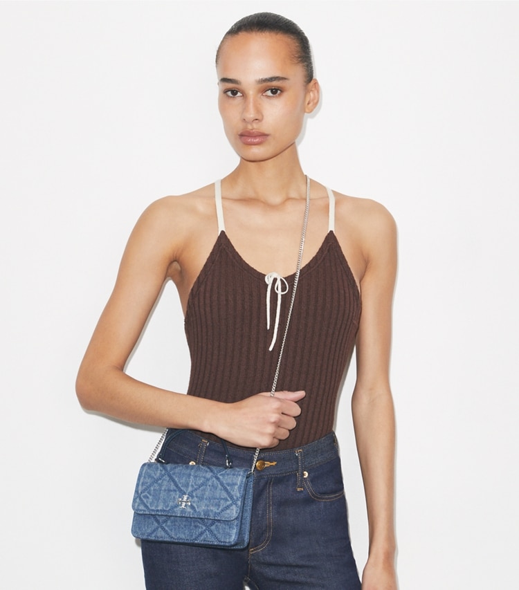 Tory Burch designer mini bags Mini Kira Diamond Quilt Denim Top-Handle Crossbody in Cruise accessory on model