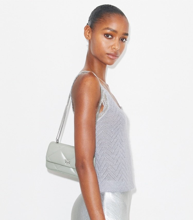 Tory Burch designer crossbody bags Mini Kira Diamond Quilt Flap Bag in Gray accessory on model