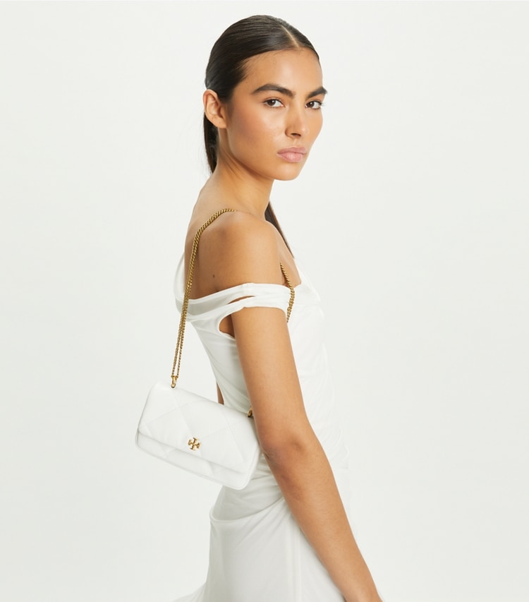 Tory Burch designer crossbody bags Mini Kira Diamond Quilt Flap Bag in Blanc accessory on model