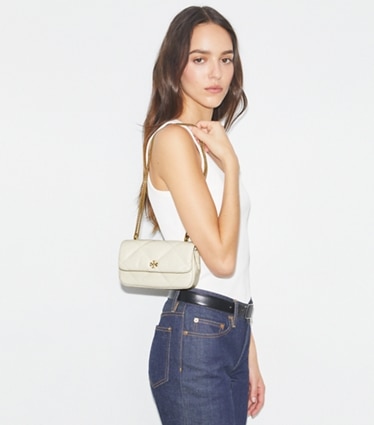 Tory Burch designer crossbody bags Mini Kira Diamond Quilt Flap Bag in Warm White accessory on model