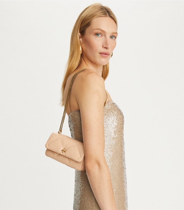 Tory Burch designer crossbody bags Mini Kira Diamond Quilt Flap Bag in Apricot accessory on model