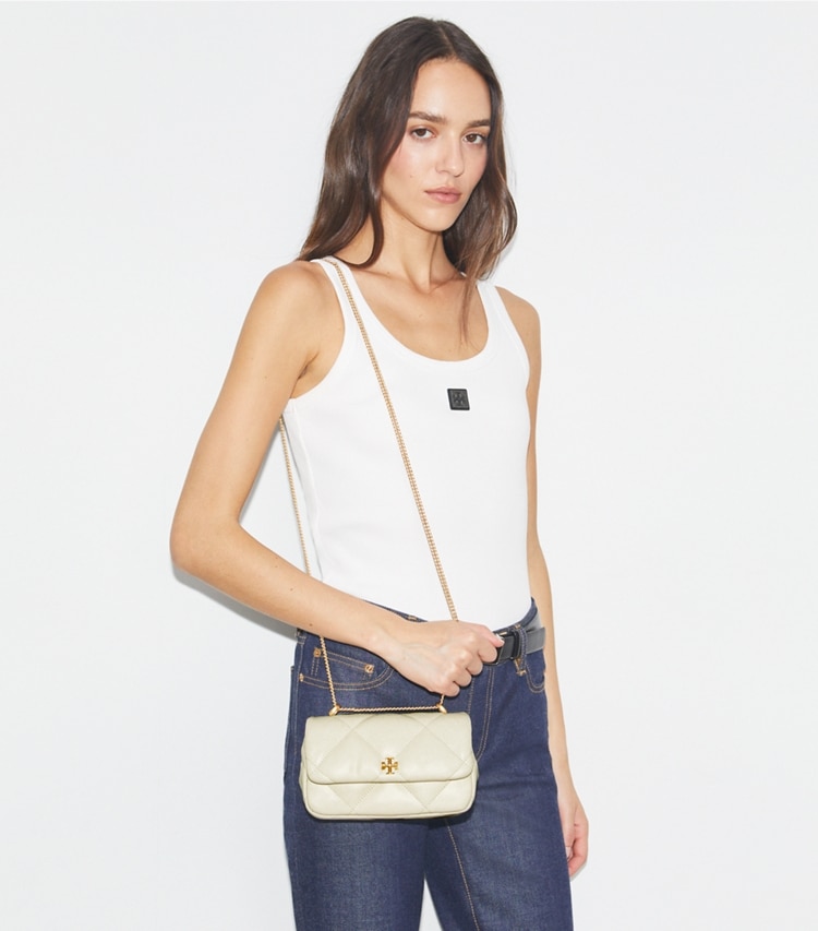 Tory Burch designer crossbody bags Mini Kira Diamond Quilt Flap Bag in Warm White additional on model