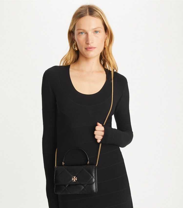 Tory Burch designer mini bags Mini Kira Diamond Quilt Pavé Logo Top-Handle Crossbody in Black accessory on model