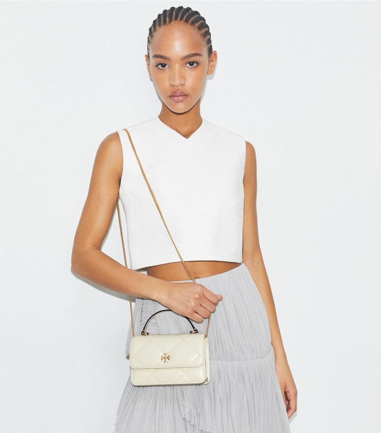 Tory Burch designer mini bags Mini Kira Diamond Quilt Top-Handle Crossbody in Warm White accessory on model