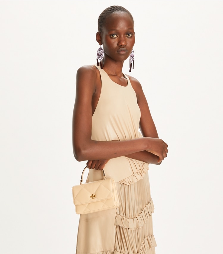 Tory Burch designer mini bags Mini Kira Diamond Quilt Top-Handle Crossbody in Vanilla Soft Serve additional on model