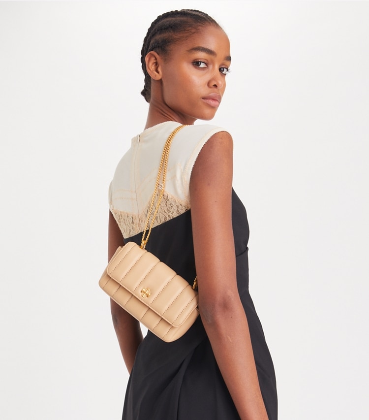 Tory Burch designer crossbody bags Mini Kira Flap Shoulder Bag in Desert Dune accessory on model