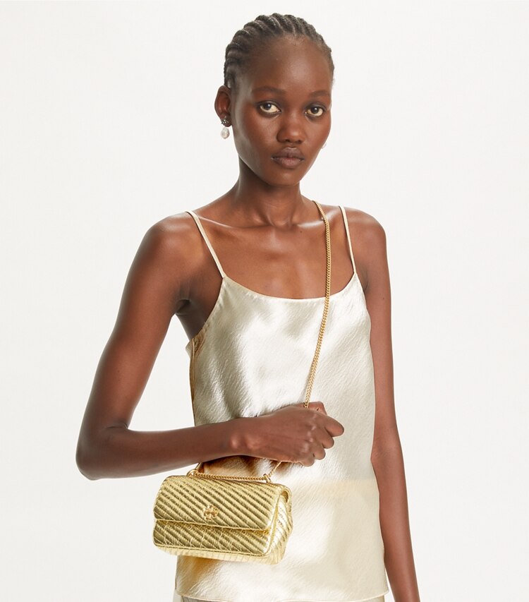 Tory Burch designer crossbody bags Mini Kira Moto Quilt Metallic Flap Bag in Gold additional on model