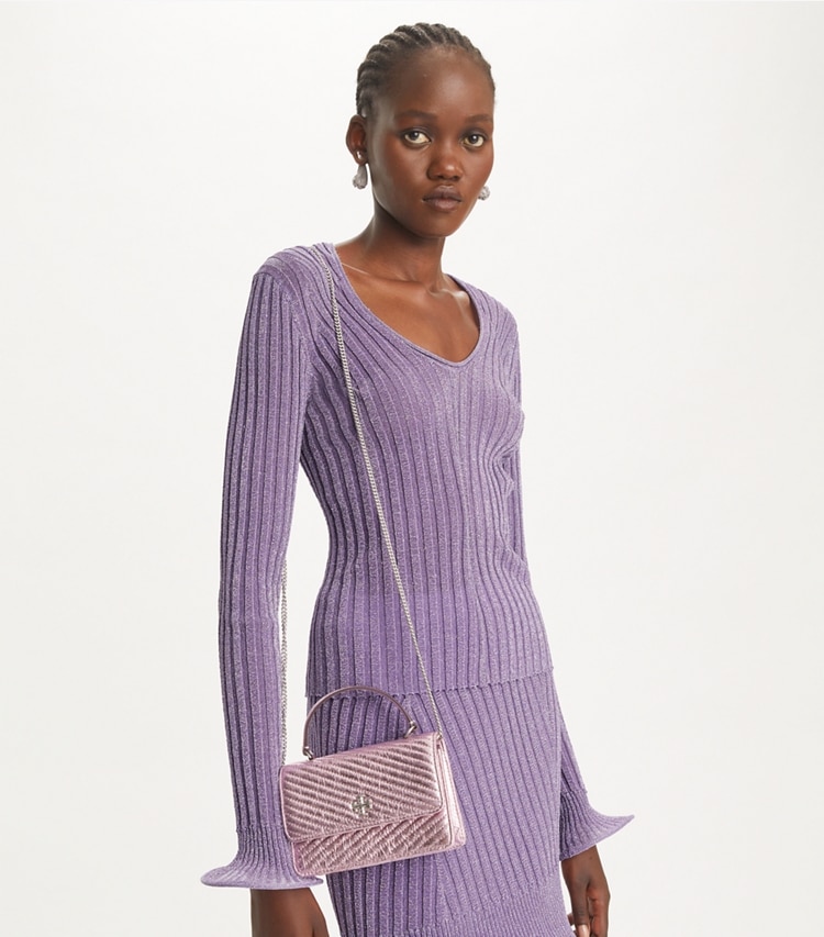 Tory Burch designer mini bags Mini Kira Moto Quilt Metallic Top-Handle Crossbody in Sparkle Pink accessory on model