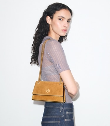 Tory Burch designer shoulder bags Mini Kira Turnlock Suede Shoulder Bag in Toffee accessory on model