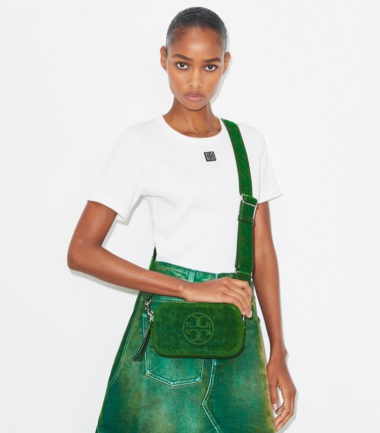 Tory Burch designer crossbody bags Mini Miller Flocked Crossbody Bag in Emerald accessory on model