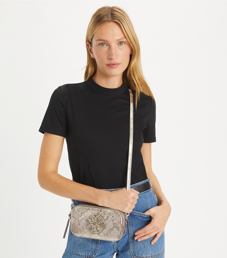 Tory Burch designer crossbody bags Mini Miller Metallic Floral-Embossed Crossbody Bag in Pewter accessory on model