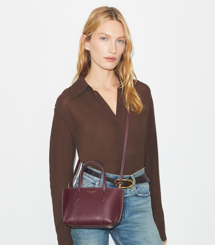 Tory Burch designer crossbody bags Mini Perry Tote in Beetle Berry accessory on model