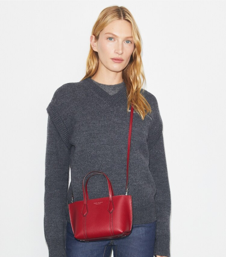 Tory Burch designer crossbody bags Mini Perry Tote in Bartlett Red accessory on model