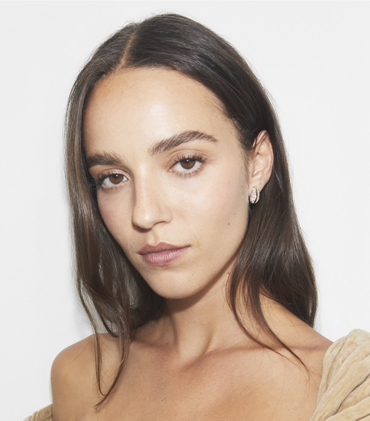 Tory Burch designer earrings Mini Pierced Pavé Earrings in Light Brass / Crystal accessory on model