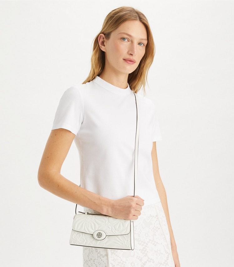 Tory Burch designer mini bags Mini Robinson Floral Embossed Crossbody in Blanc accessory on model
