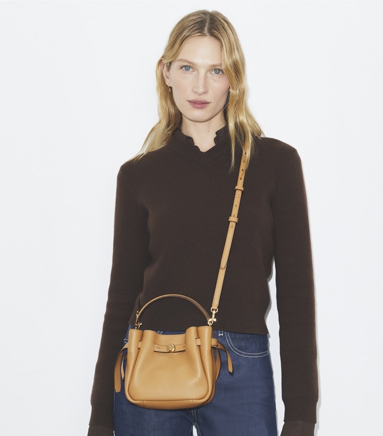 Tory Burch designer crossbody bags Mini Romy Bucket Bag in Tiramisu accessory on model