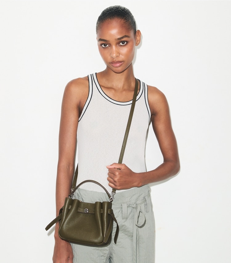 Tory Burch designer crossbody bags Mini Romy Bucket Bag in Dark Olive accessory on model