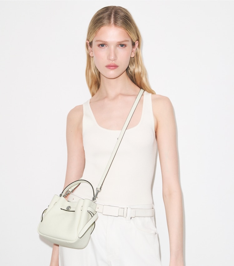 Tory Burch designer crossbody bags Mini Romy Bucket Bag in Light Cream accessory on model