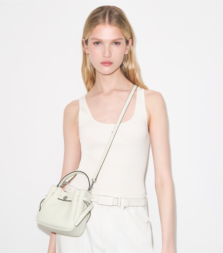 Tory Burch designer crossbody bags Mini Romy Bucket Bag in Light Cream accessory on model