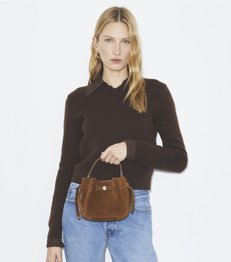 Tory Burch designer crossbody bags Mini Romy Suede Bucket Bag in Caramel additional on model
