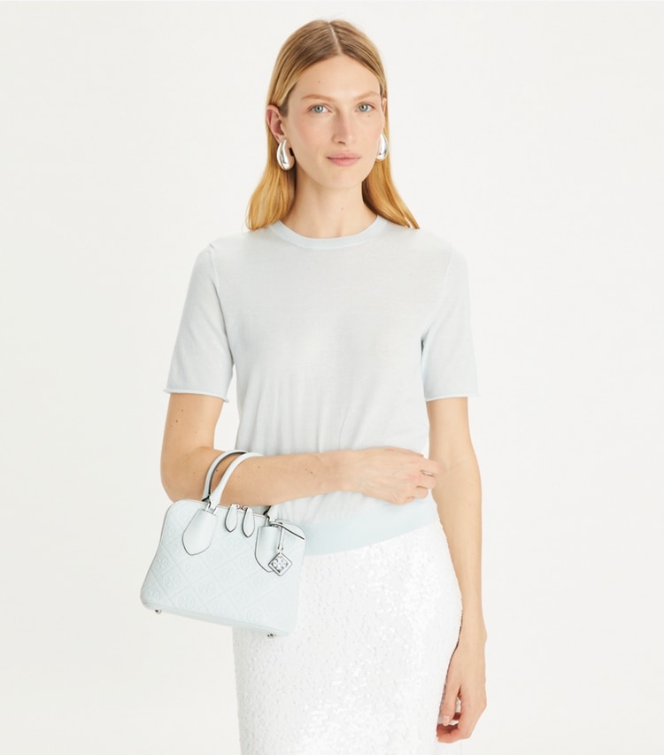 Tory Burch designer crossbody bags Mini T Monogram Leather Swing Satchel in Ice Blue accessory on model
