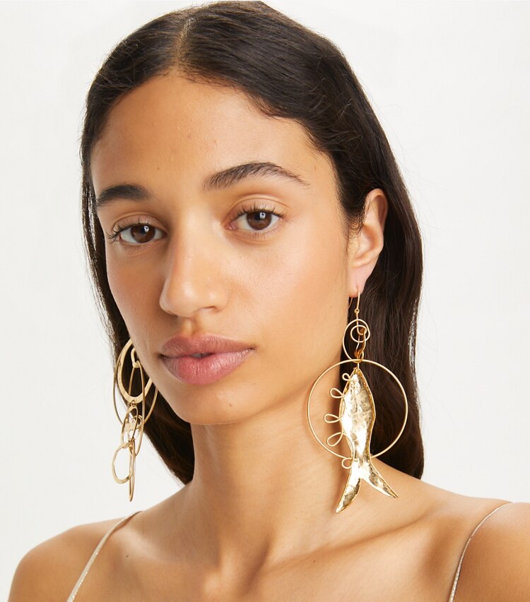 Tory Burch designer earrings Mismatched Fish Earring in Rolled Light Brass accessory on model