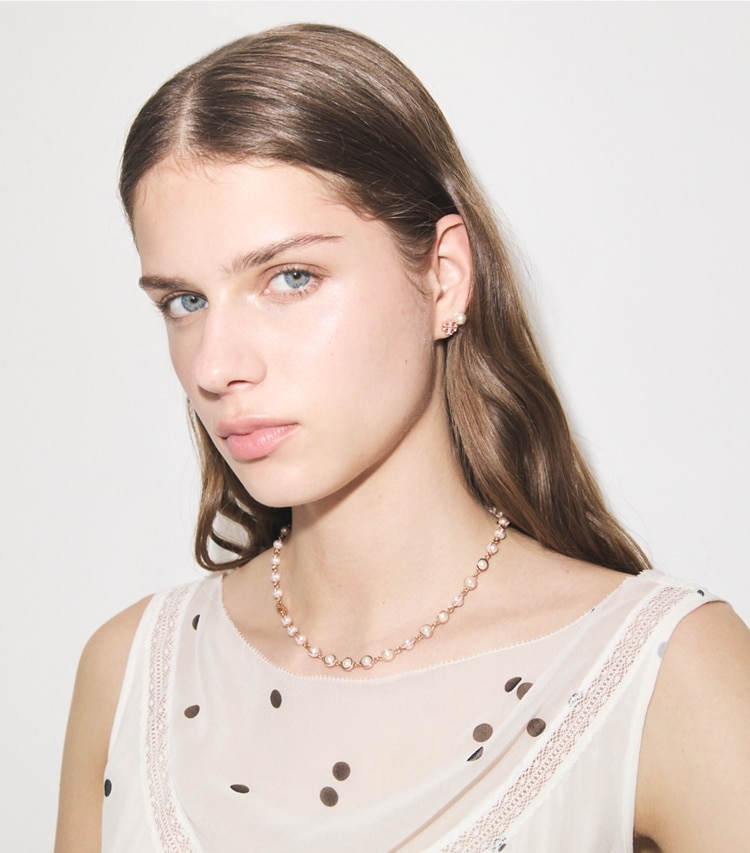 Tory Burch designer necklaces Moondance Pearl Necklace in Light Brass / Pearl / Pink accessory on model