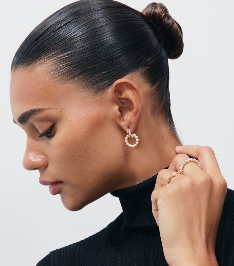 Tory Burch designer rings Moondance Stacking Ring Set in Tory Gold / Cream / Crystal accessory on model