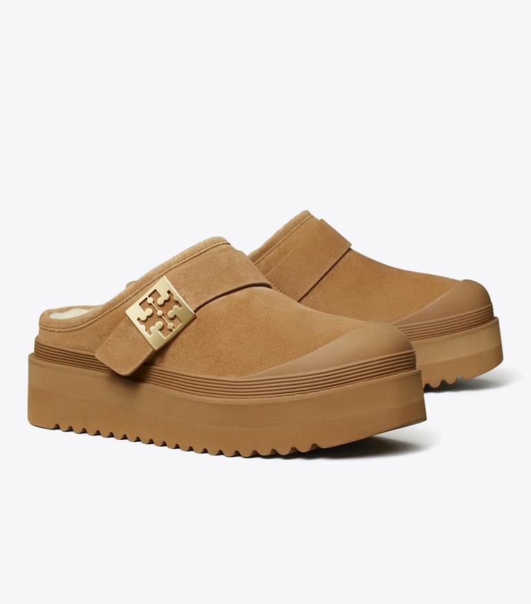 Tory Burch diseñador zapatos planos Mules de plataforma de borreguillo Mellow en CHESTNUT / GOLD ángulo