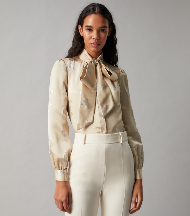 Tory Burch designer tops Mushroom Lurex Bow Blouse in Pale Champagne on model detail