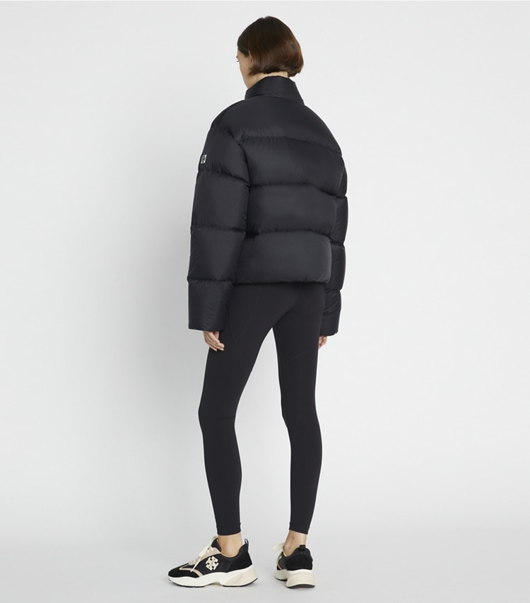 Tory Burch designer coats Nylon Down Puffer Jacket in Black on model back